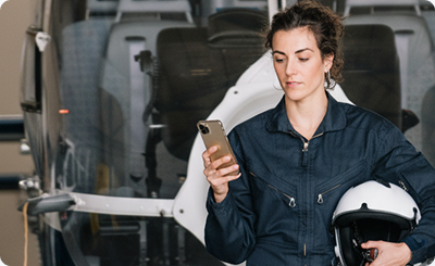 Club member checking aircraft data on her phone